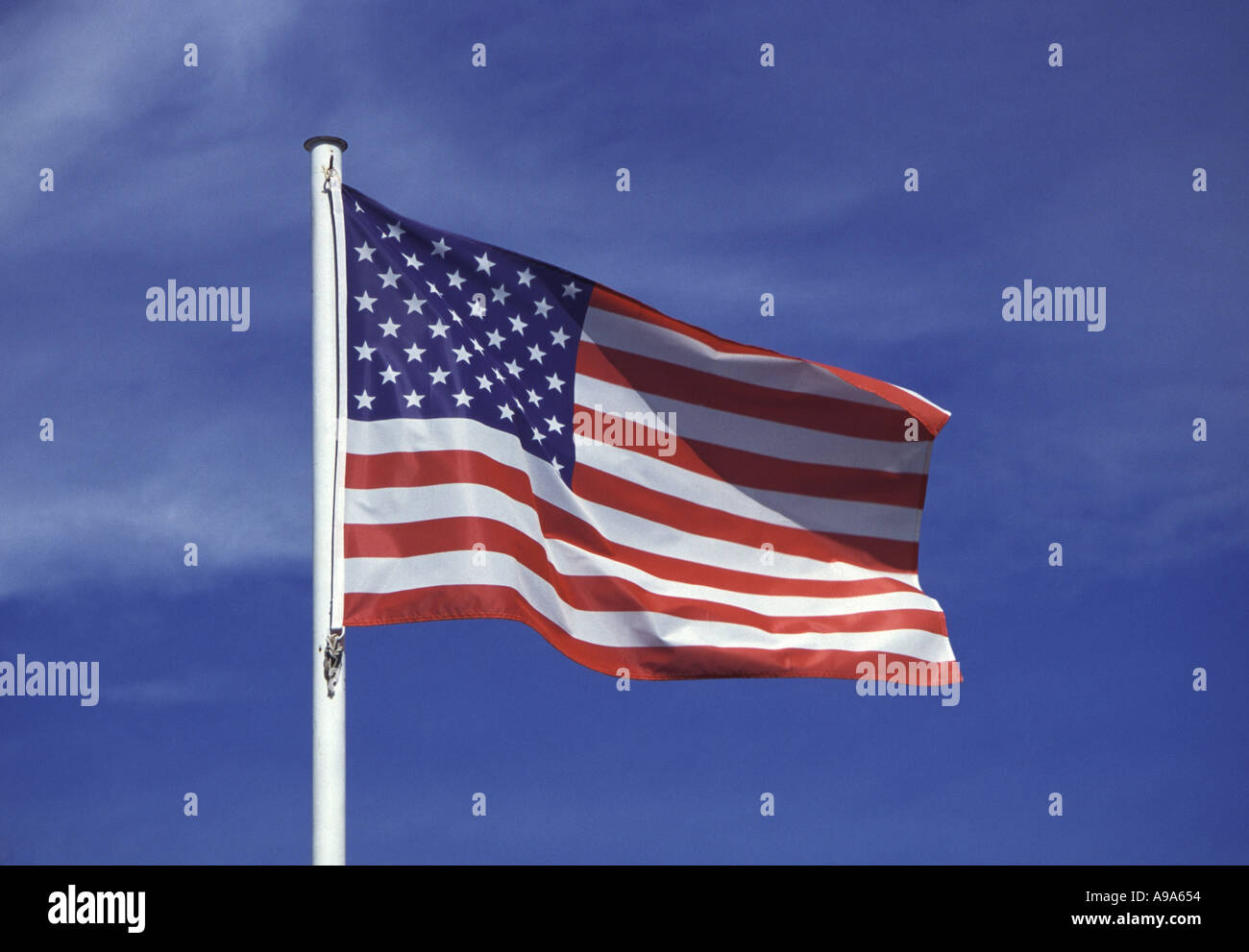 American flag flying in the wind Stock Photo - Alamy