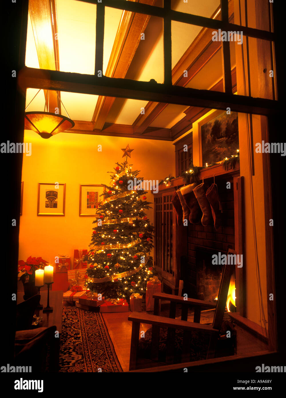 CHRISTMAS TREE IN ROOM SEEN THROUGH WINDOW OF ARTS AND CRAFTS HOUSE USA