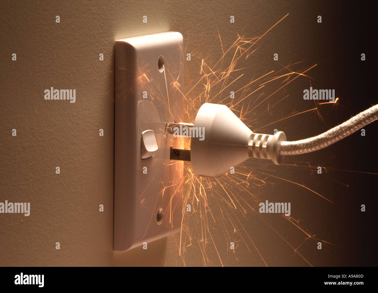 wall plug sparking Stock Photo