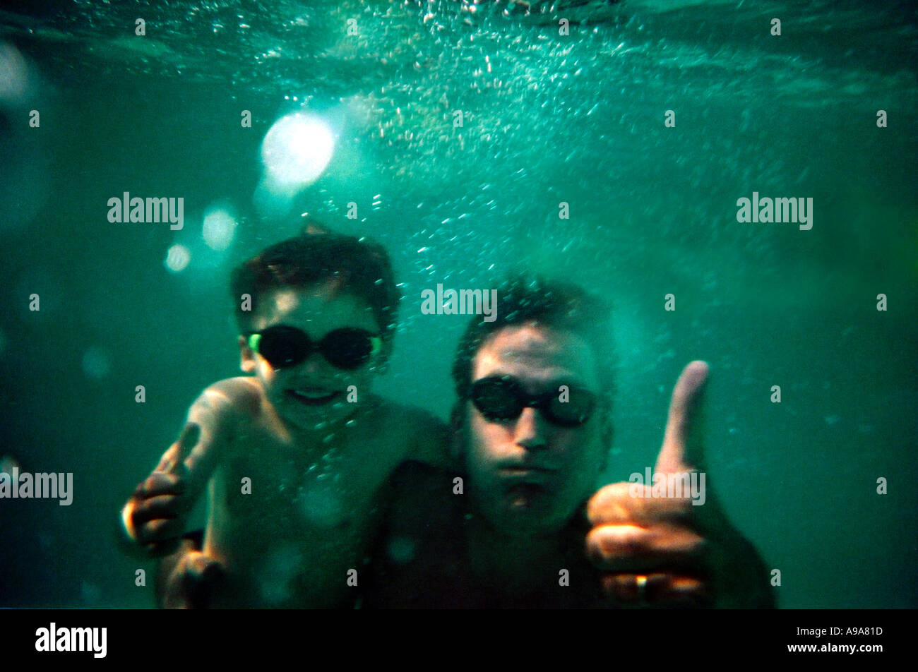 man-swimming-underwater-up