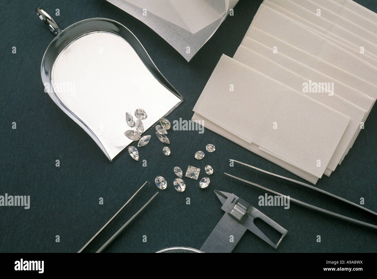 LARGE DIAMONDS JEWELERS MEASURING TOOLS ON PLAIN GRAY BACKGROUND Stock