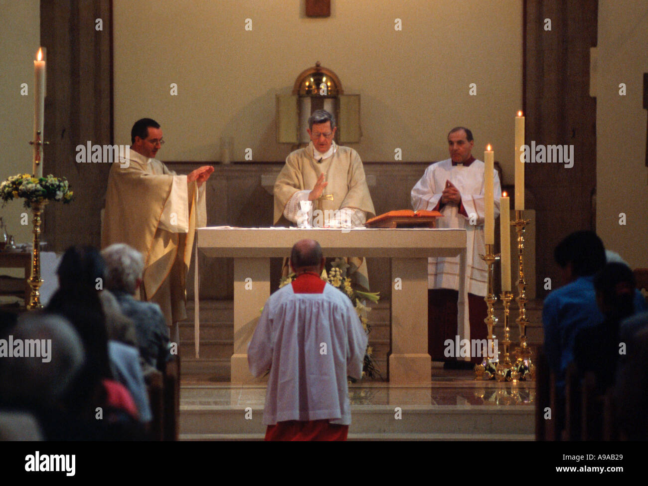 Bishop Tripp says the Eucharistic prayer during catholic mass nr London UK Stock Photo