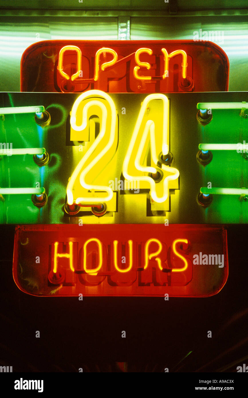 NEON OPEN 24 HOURS SIGN Stock Photo