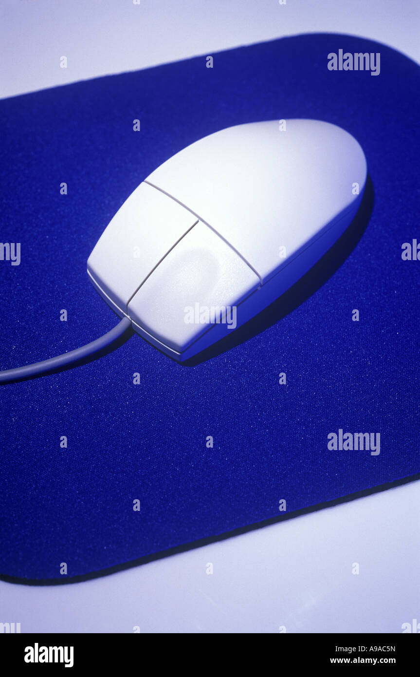 PERSONAL COMPUTER MOUSE ON BLUE MOUSE PAD Stock Photo - Alamy
