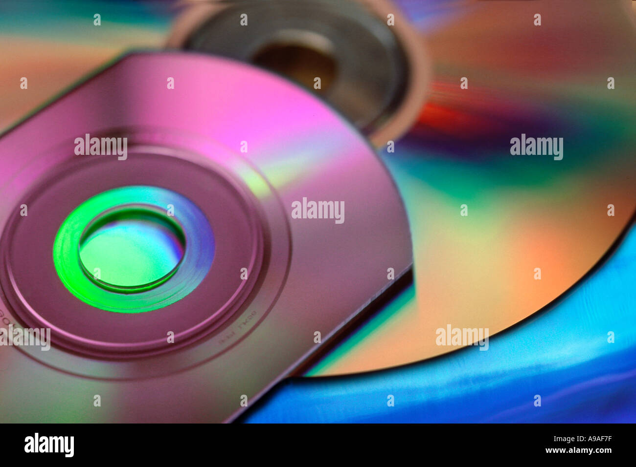 Multiple computer and music CD disks with rainbow color Stock Photo - Alamy