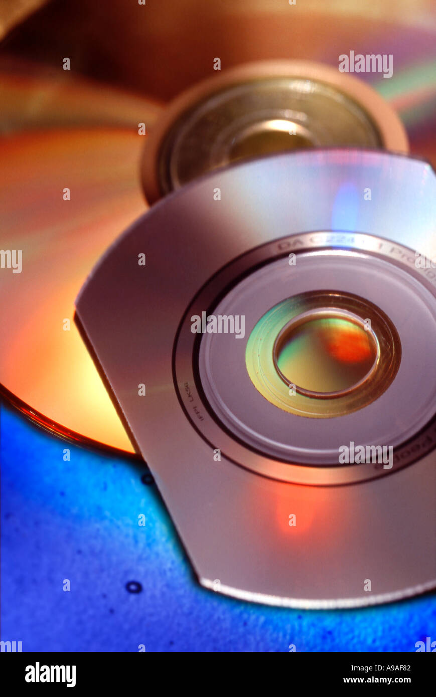 Multiple computer and music CD disks with rainbow color Stock Photo Alamy