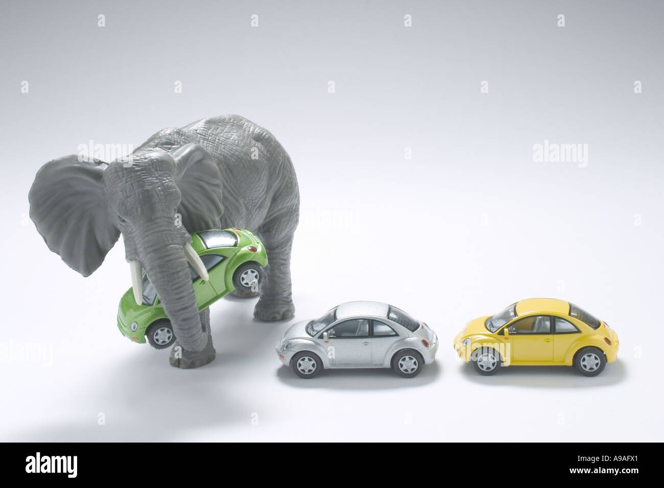 Miniature Elephant with Toy Cars Stock Photo