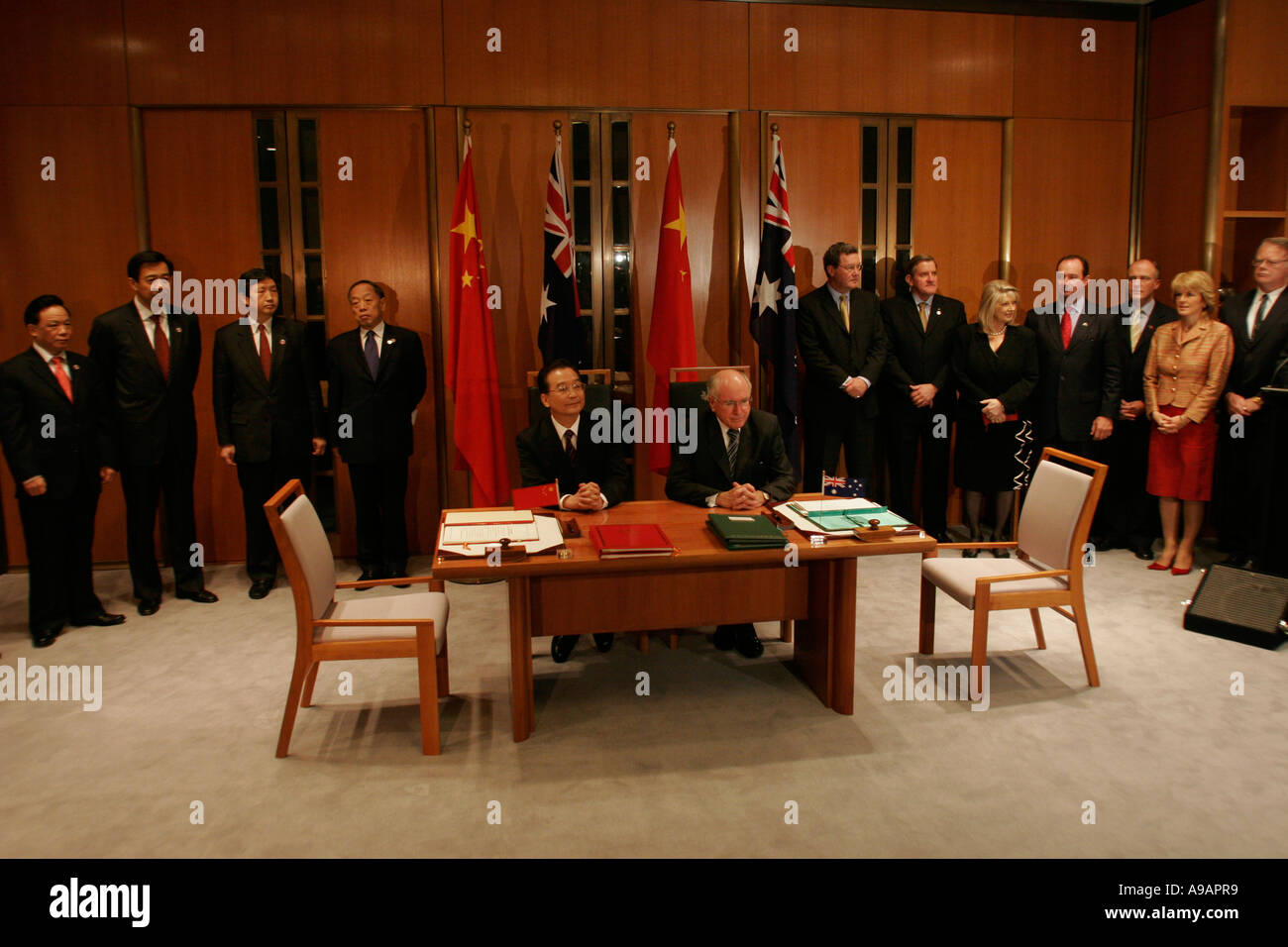 Premiere Chen Jiabao left and Prime Minister John Howard right during a uranium trade agreement signing Canberra 2006 Stock Photo