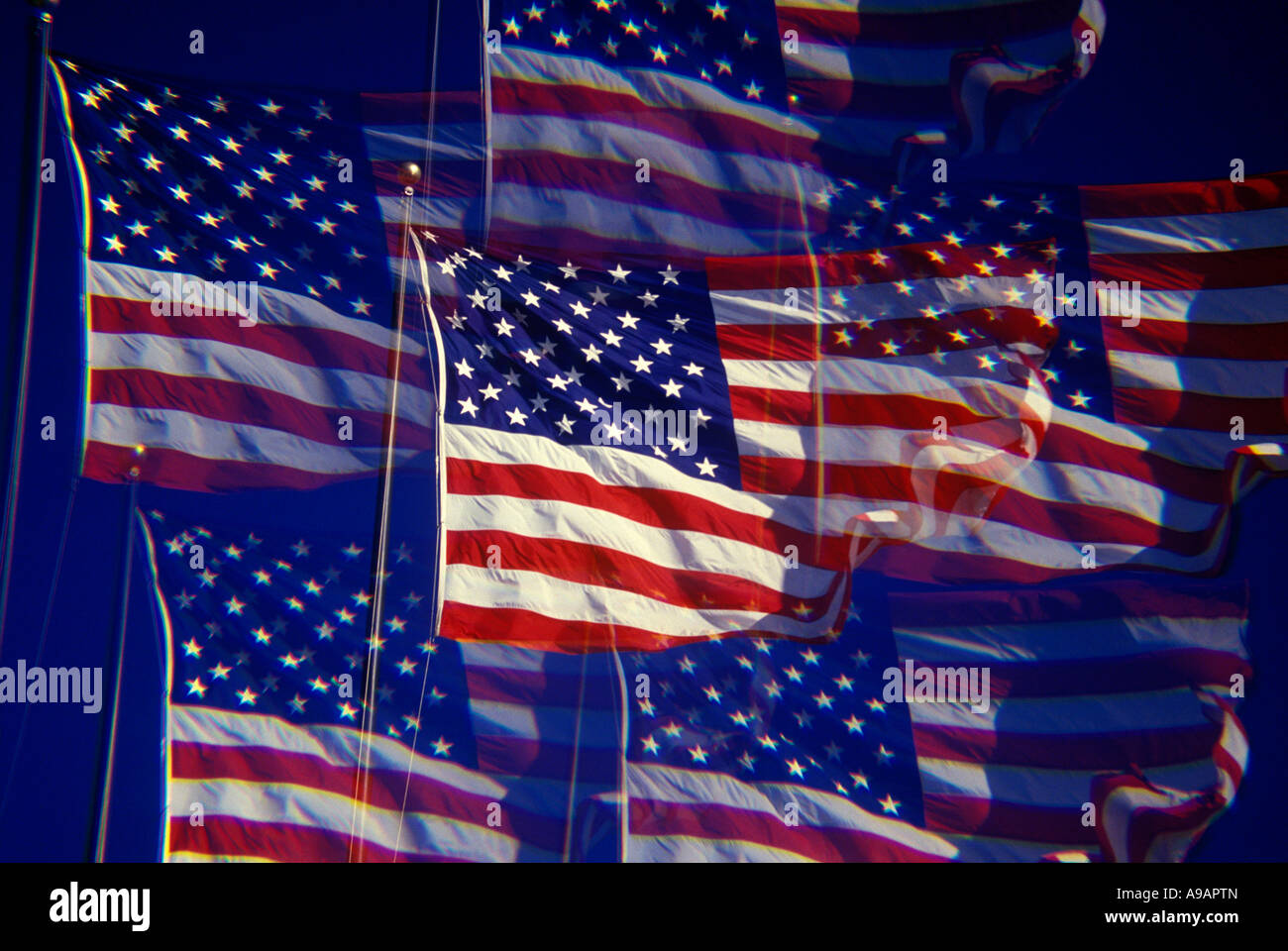 UNITED STATES FLAG FLYING ON FLAGPOLE WITH BLUE SKY Stock Photo - Alamy