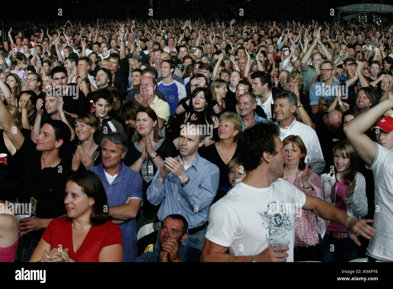 Fans celebrate the beginning of the Rolling Stones concert in Sydney April 2006 Stock Photo