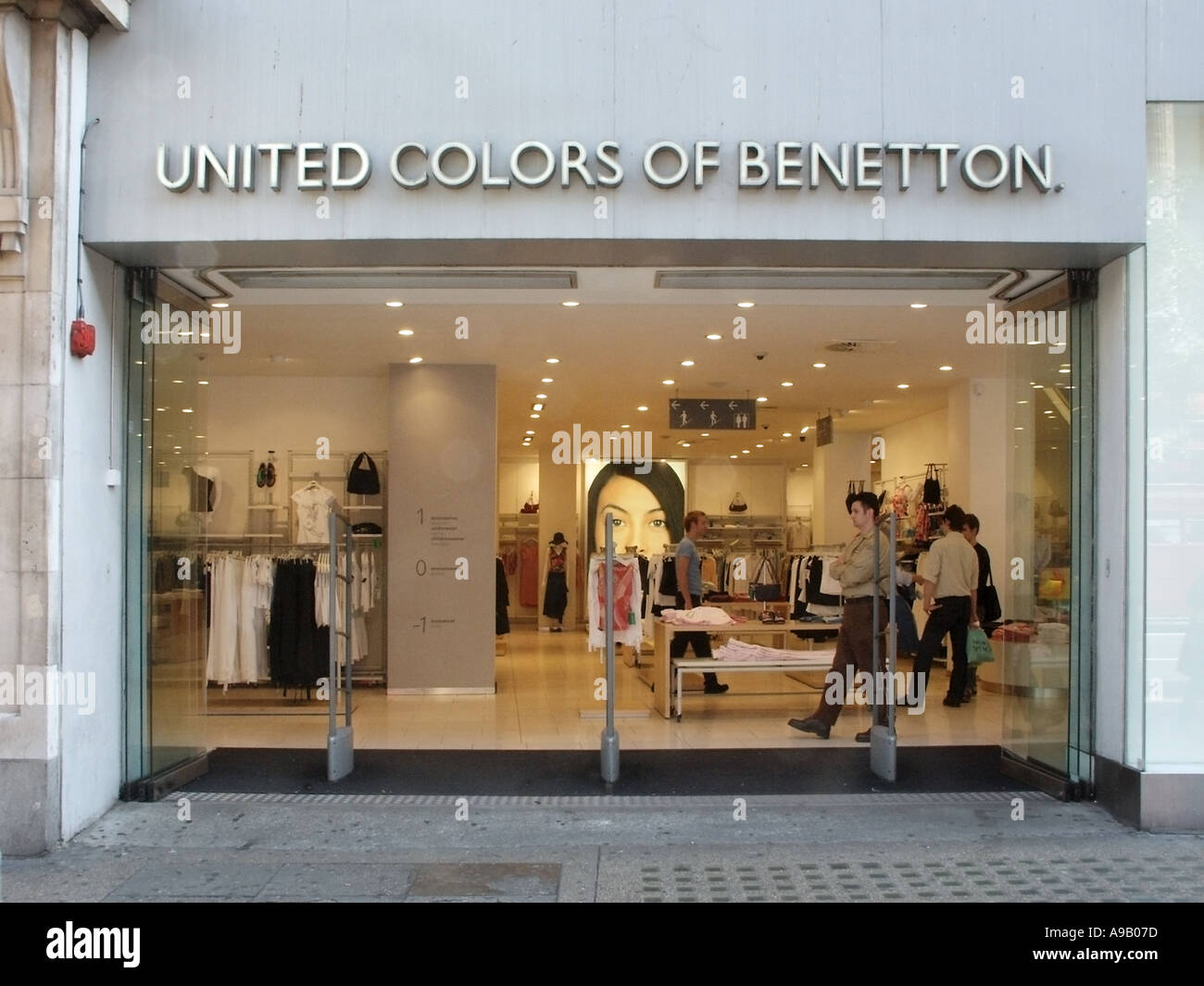 Entrance no doors interior of United Colors of Benetton fashion clothing  retail business store from pavement Oxford Circus West End London England UK  Stock Photo - Alamy