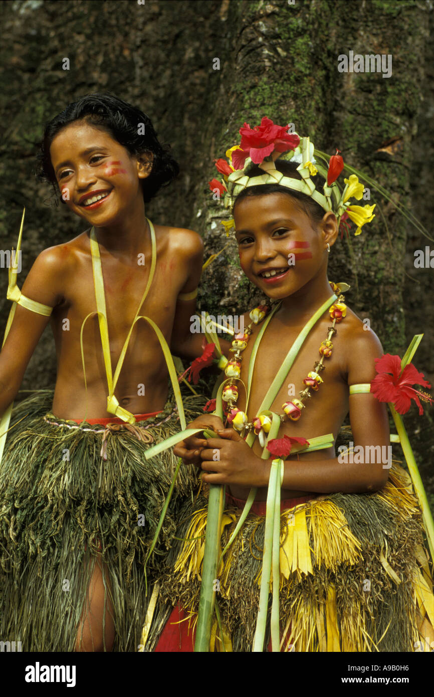 Two Yapese girls dressed up in grass skirts and flowers at school graduation on Yap the Federated States of Micronesia Stock Photo