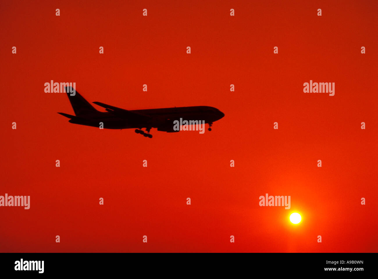 AIRBORNE COMMERCIAL PASSENGER AIRCRAFT LANDING Stock Photo