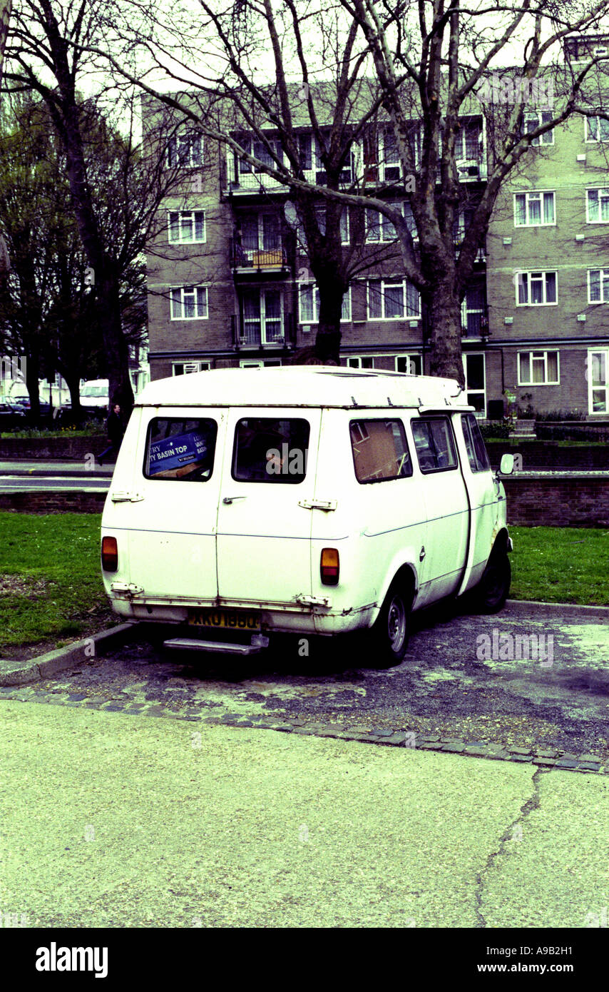 White van parked on a council estate Stock Photo