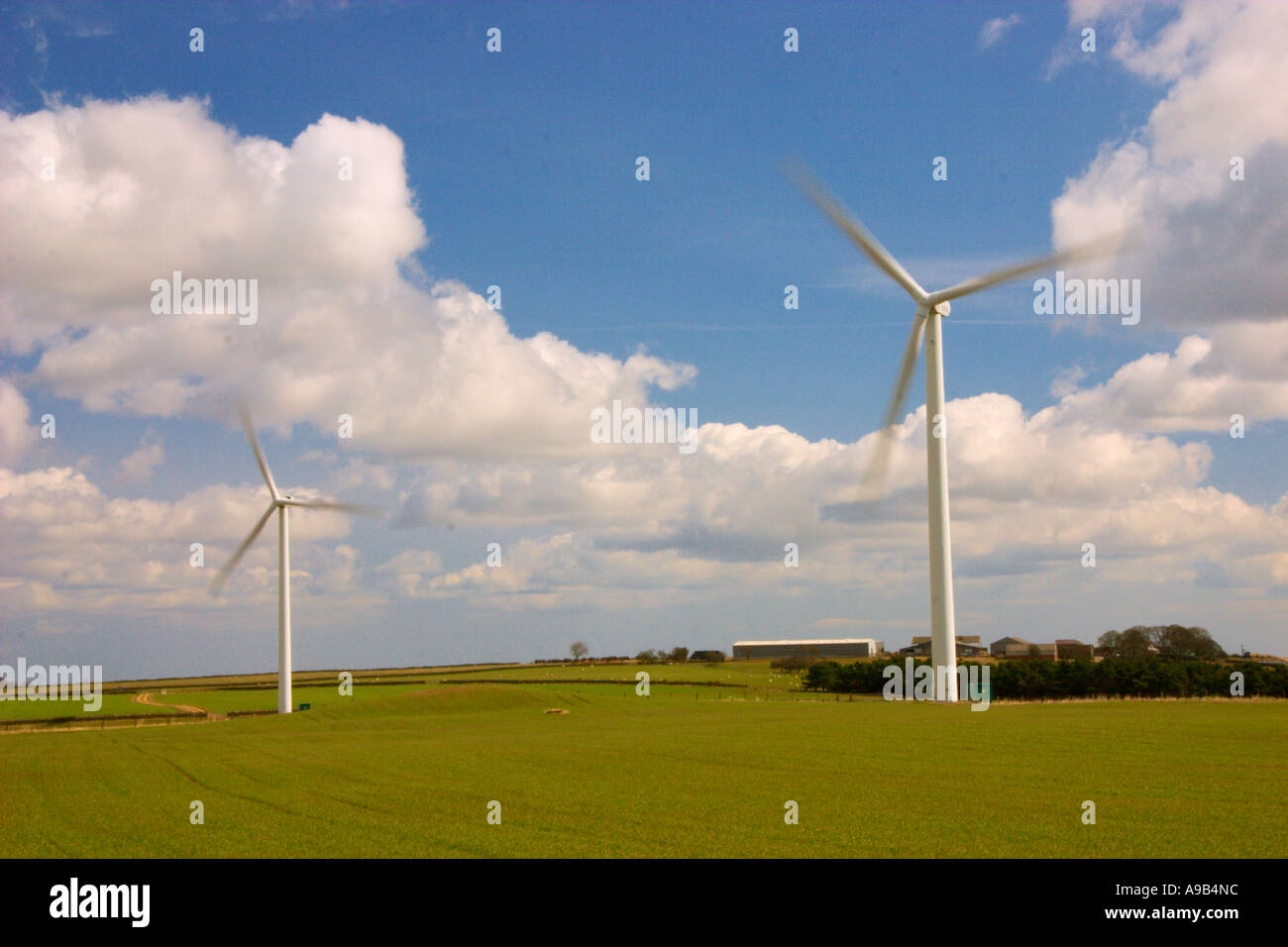 Wind farm in countryside with blue sky and clouds Stock Photo - Alamy