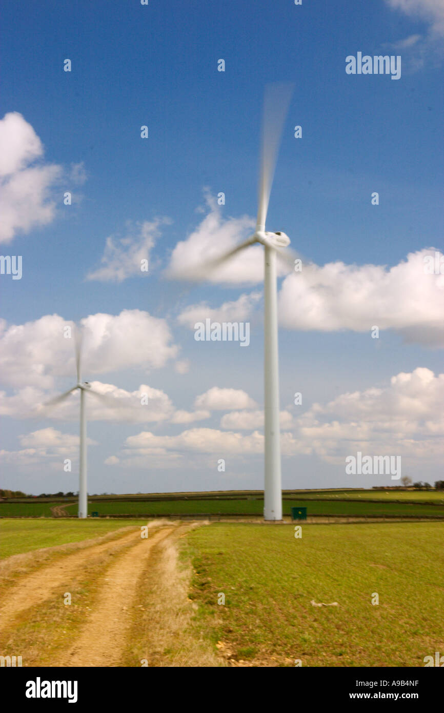Wind farm in countryside with blue sky and clouds Stock Photo - Alamy