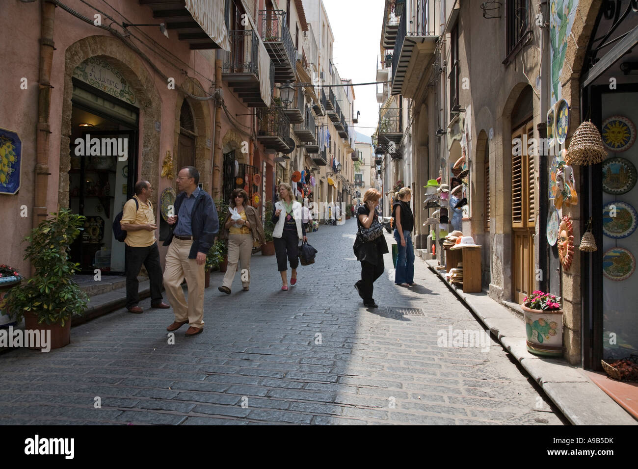 Shops and people shopping along Corso Ruggero Cefalu ...