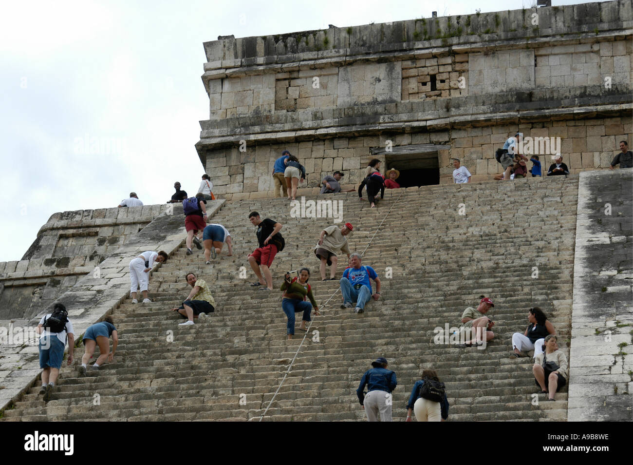 Visitors climb Chichen Itza, the great Maya Toltec ceremonial centre
