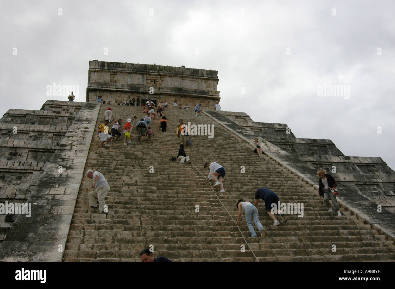 Visitors climb Chichen Itza, the great Maya Toltec ceremonial centre
