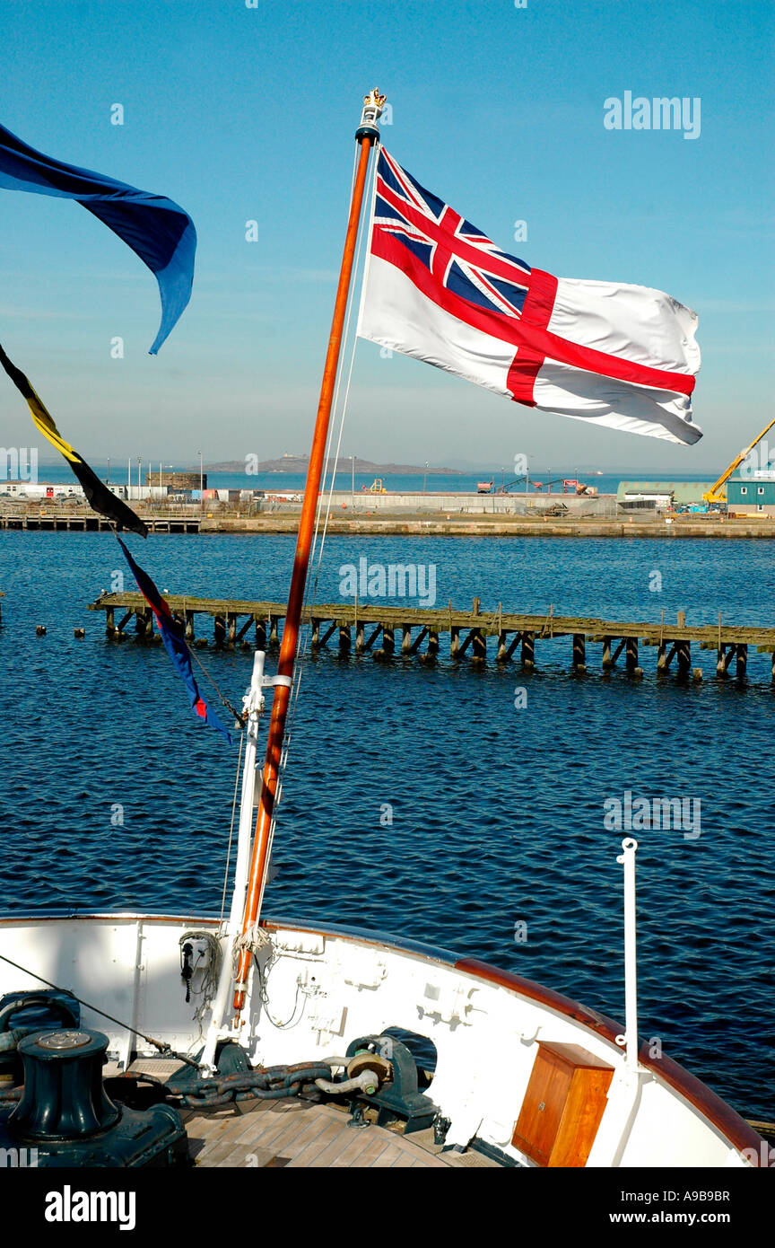 White Ensign flag flying from the Royal Yacht Britannia,Ocean Quay,Firth of Forth,Edinburgh,Scotland,United Kingdom Stock Photo