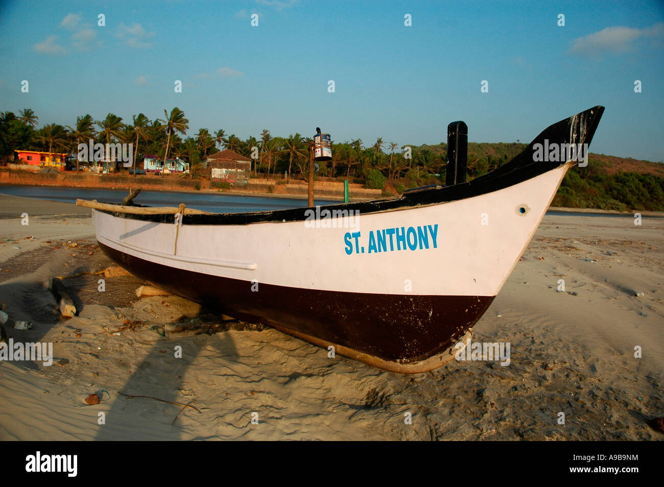 Wooden fishing boat with a fishing tackle at the sealandscape. Indian  national boat muchee walla on the Goa beach. Stock Photo
