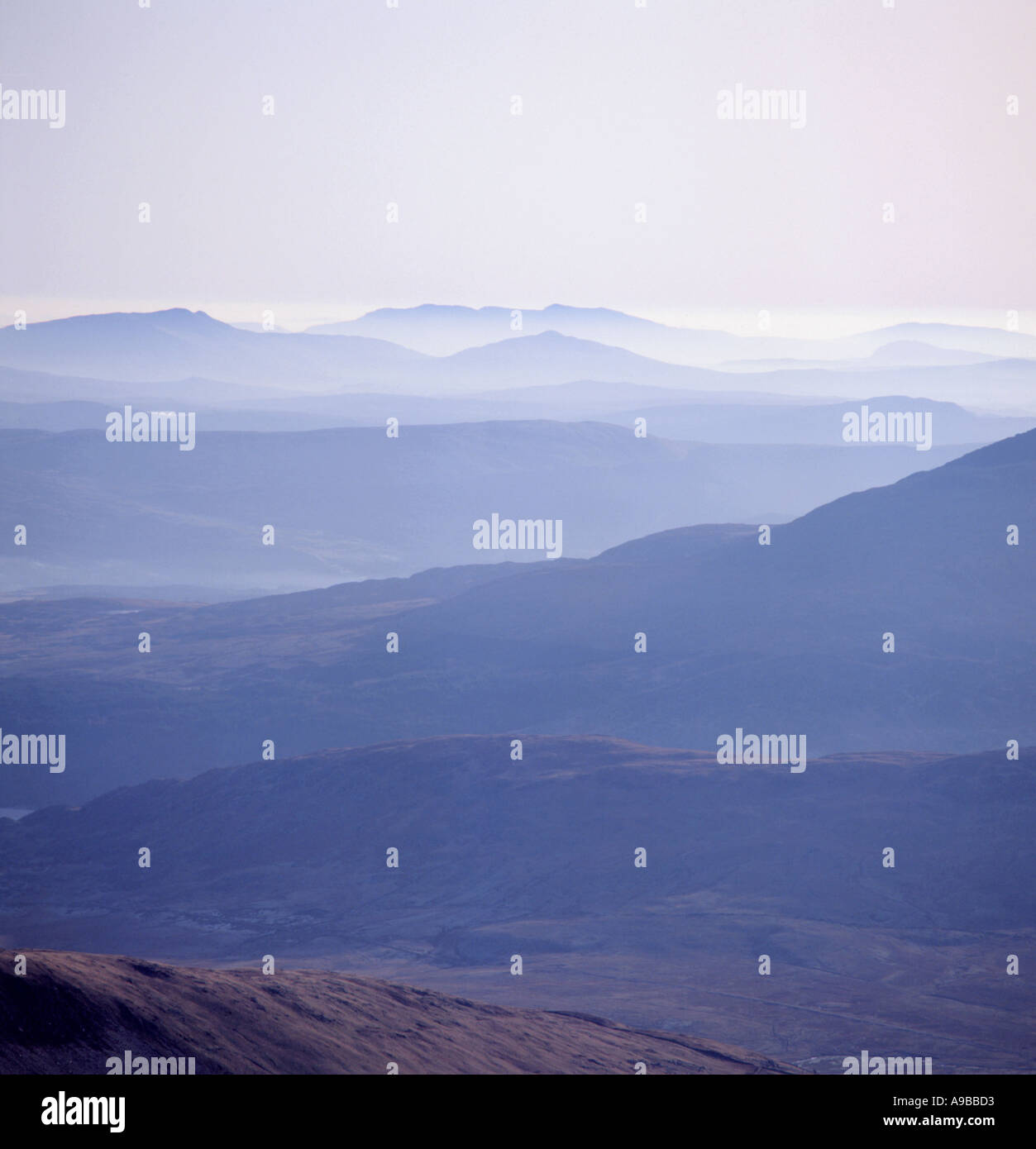 View of distant mountains; The Berwyn hills seen from Carnedd Llewelyn, Snowdonia National Park, Gwynedd, North Wales, UK. Stock Photo