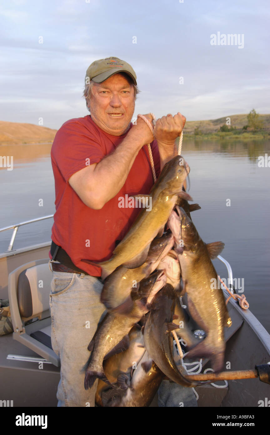Doug Wilson with a stringer of channel catfish on Brownlee Reservoir near  Farewell Bend Brownlee Reservoir an impoundment on Stock Photo - Alamy