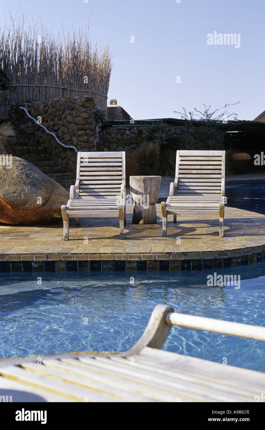 South Africa, deck chairs by poolside Stock Photo Alamy