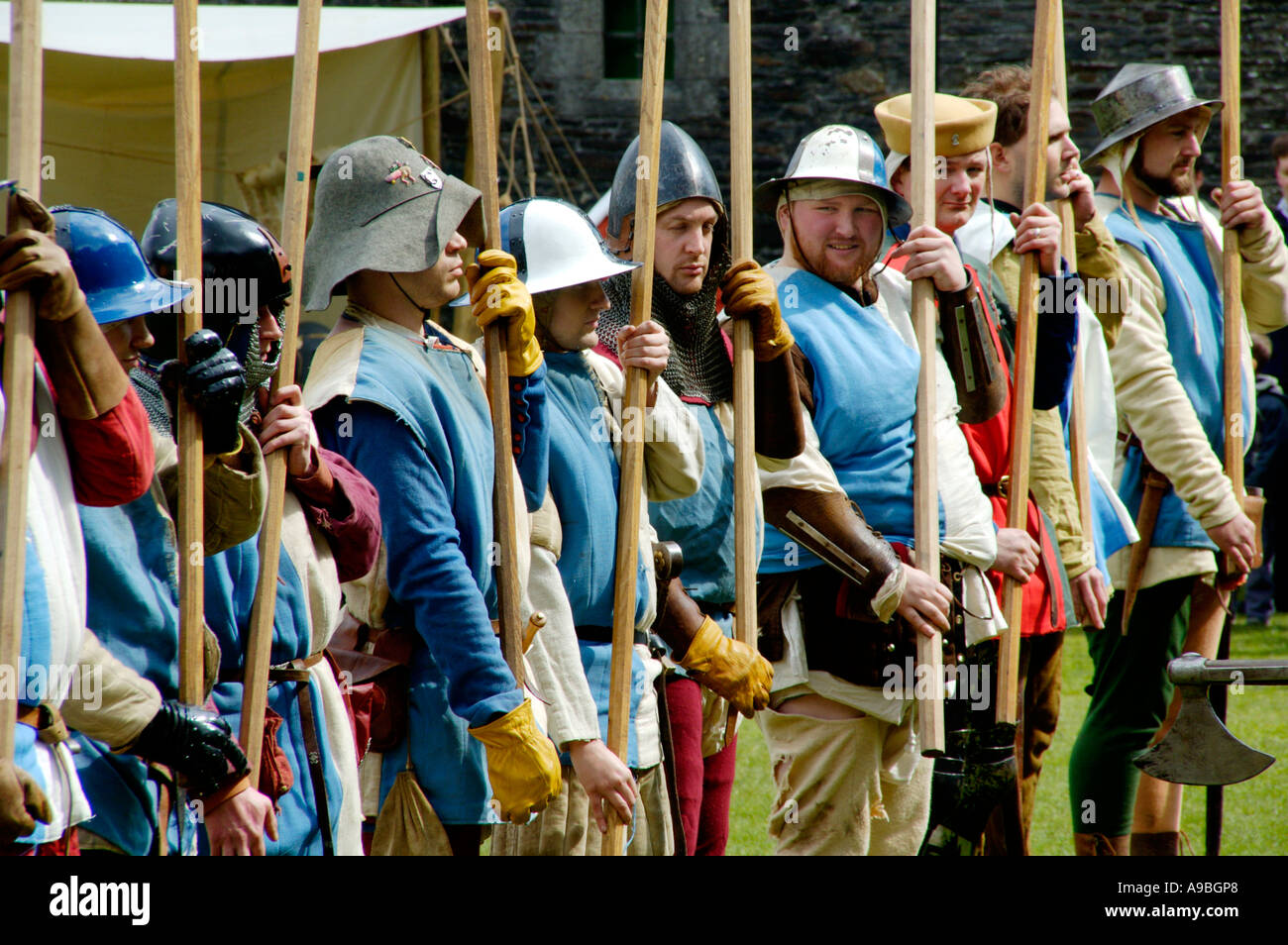 The Company of Chivalry re enact medieval life in the year 1370 at Caerphilly Castle South Wales UK GB Stock Photo