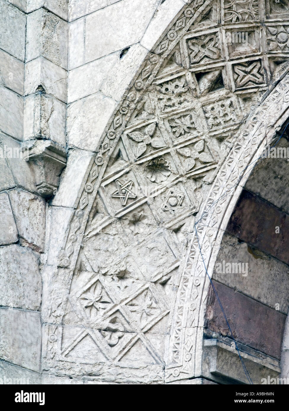 detail of carving on arch above entrance, Bab al-Futuh, Cairo, Egypt Stock Photo