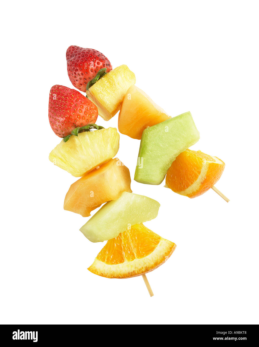 Fruit kebobs on white background with clipping path Stock Photo