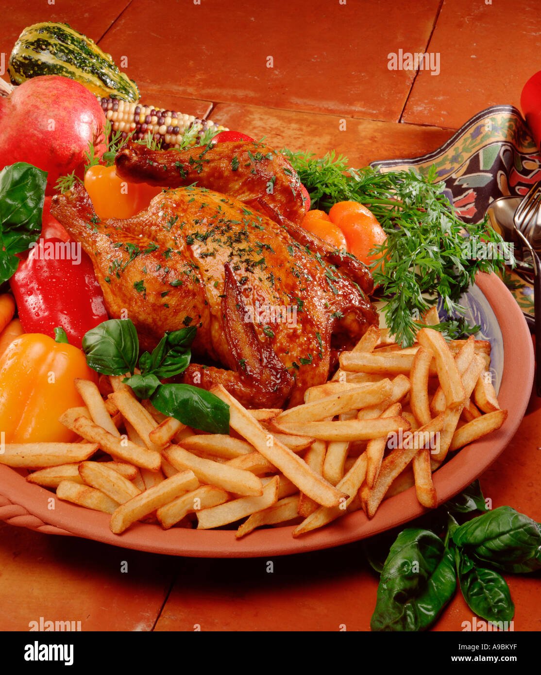 Mexican style roast chicken, vegetables and fries Stock Photo Alamy