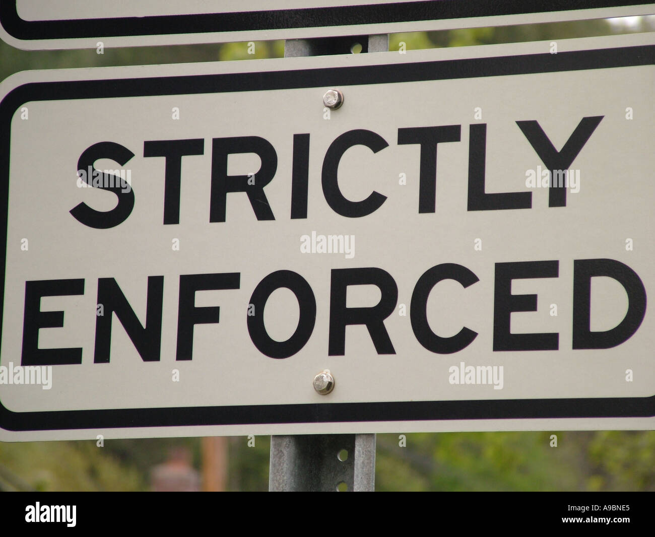 AJD42698, road sign, strictly enforced, speed limit sign Stock Photo