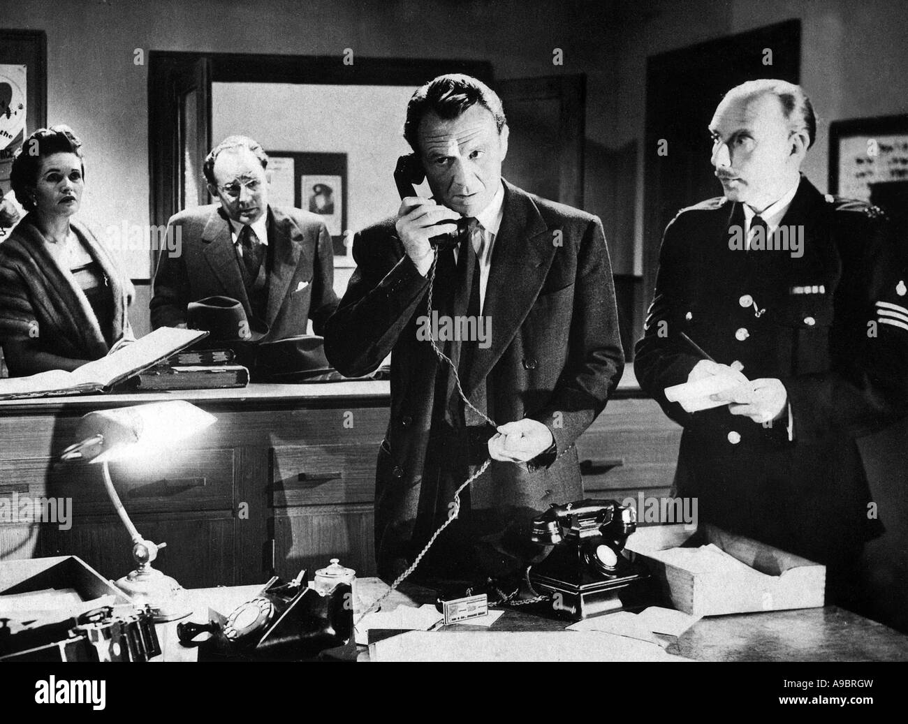 TOWN ON TRIAL 1956 Columbia film with from left: Margareta Scott, Geoffrey Keen and John Mills Stock Photo
