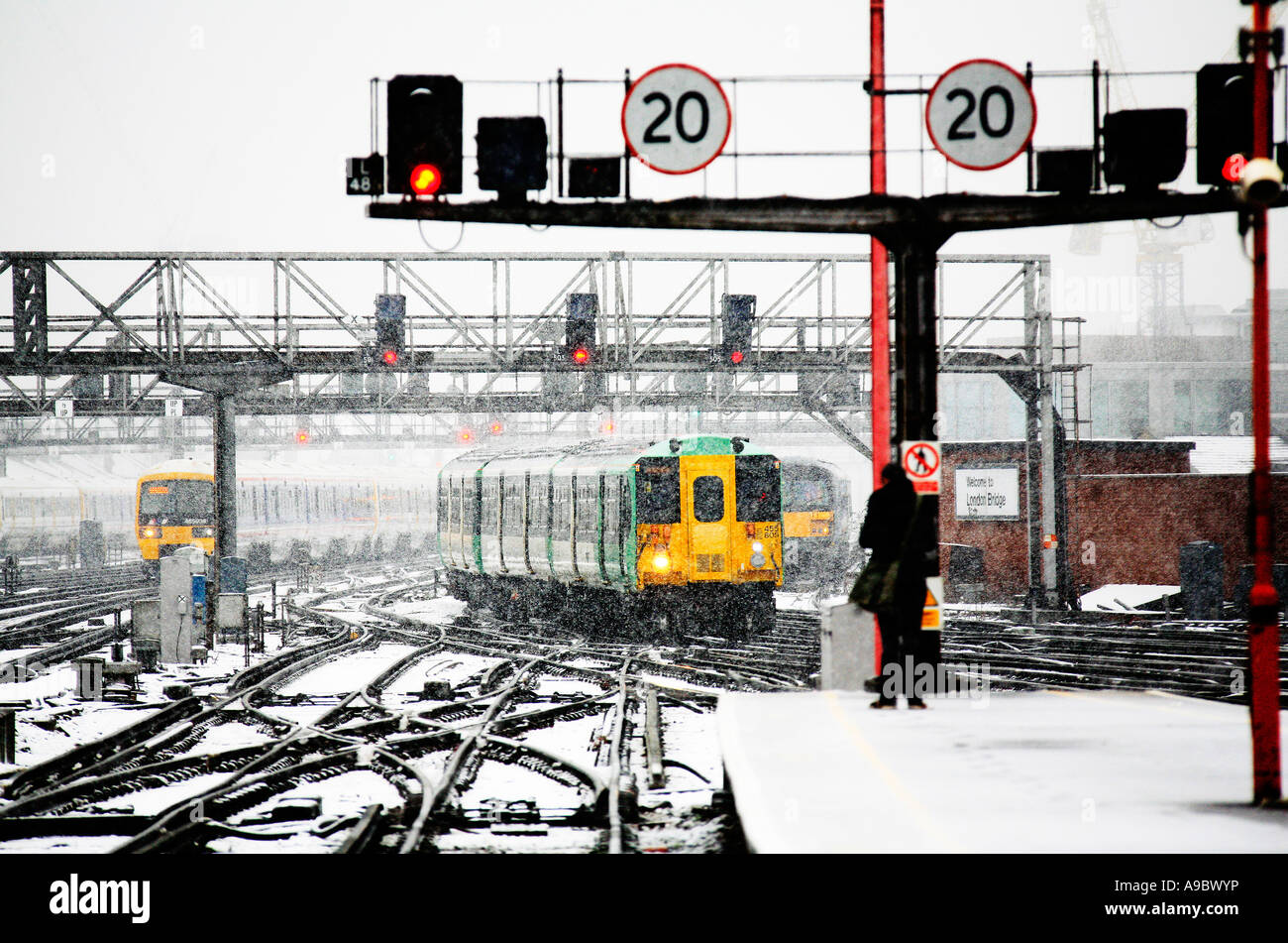 London urban train in snow at London Bridge station Stock Photo