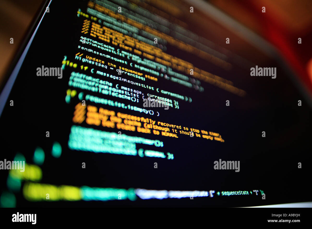 Highly technical looking computer program on screen in darkened room Stock Photo