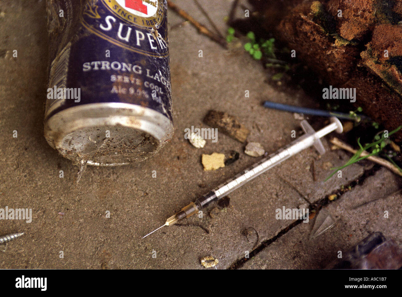 Needles used to inject illegal drugs thrown on ground after use Stock