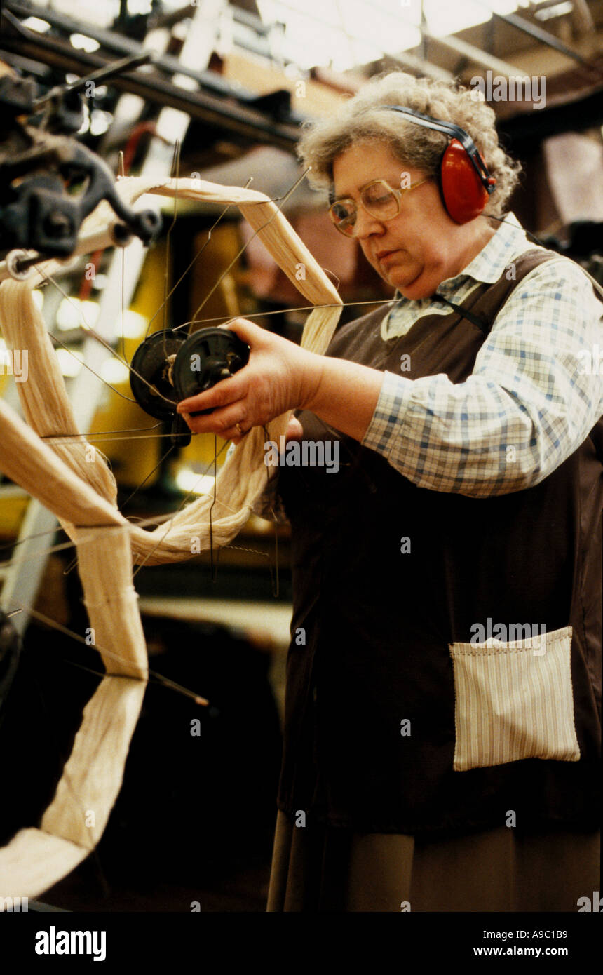 Woman at work ion wicks in Prices candle factory London Stock Photo Alamy
