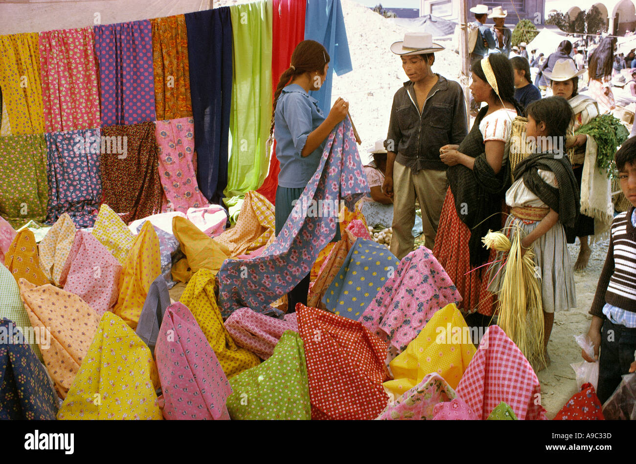 Textiles on sale at market in village in Oaxaca State Mexico Stock