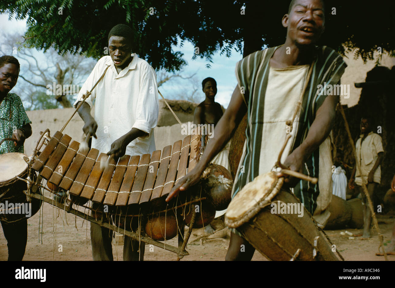 Musicians of Bobo ethnic group playing drums and balafon xylophone in Koumbia Burkina Faso Africa Stock Photo