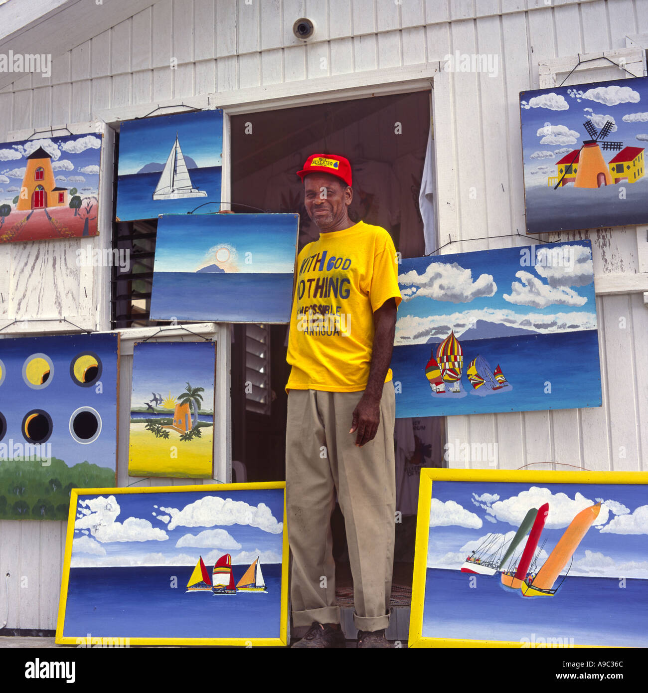 Local artist displays his original paintings hung around doorway of his