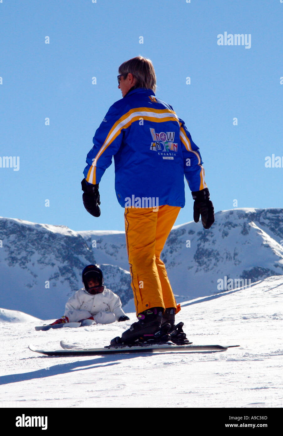 Engadine ski school instructor and child pupil St Moritz Switzerland Stock Photo