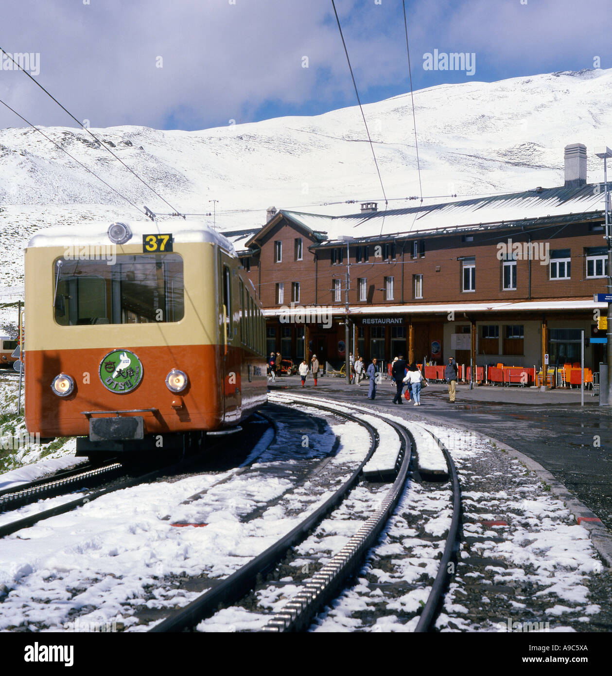 Electric Mountain Train at Kleine Scheidegg in Switzerland Stock Photo