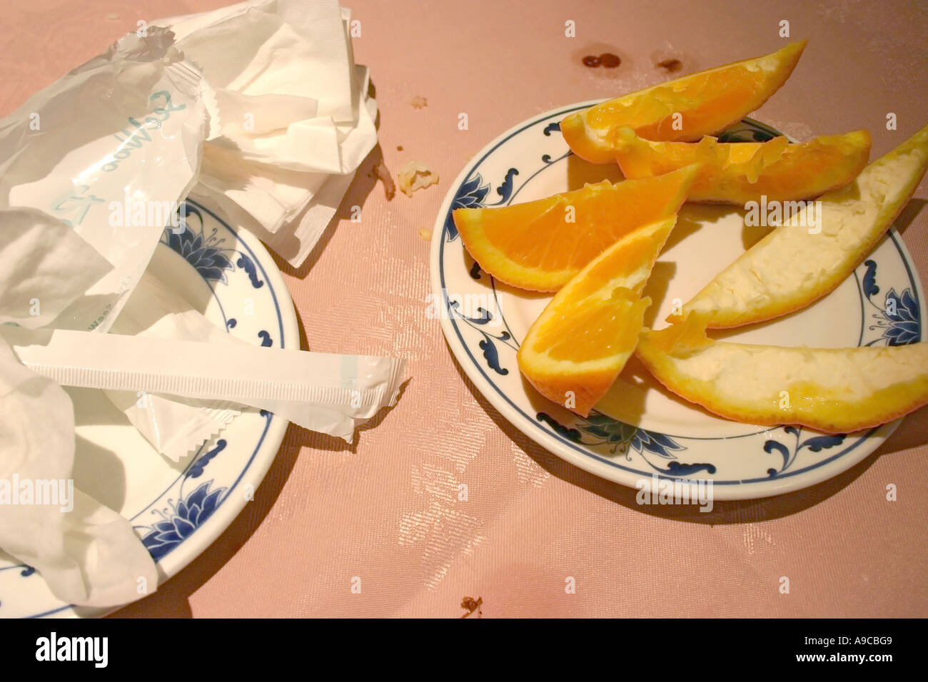 leftover orange segments after chinese meal Stock Photo