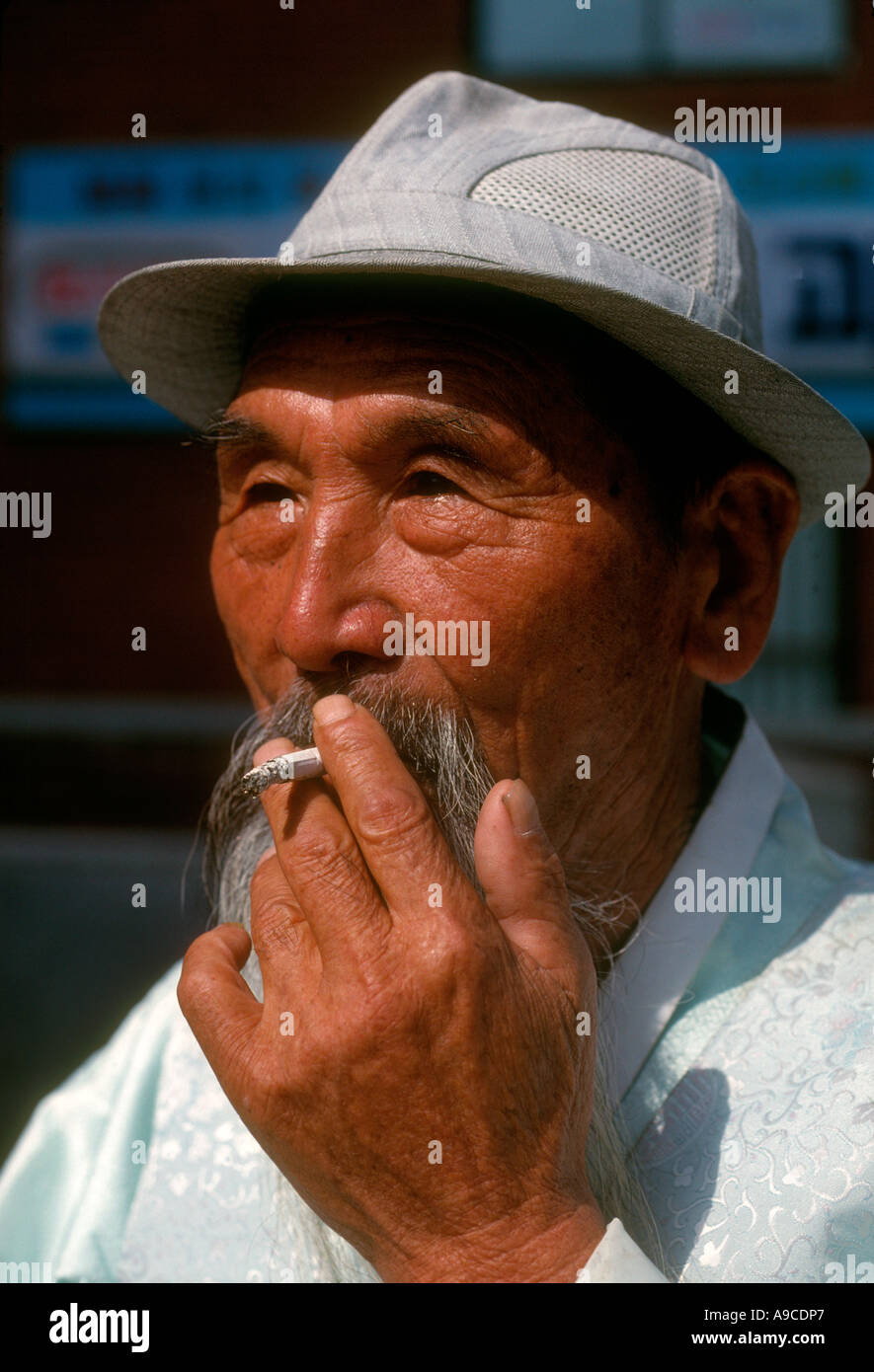Smoking old man in Chejudo cheju island south korea Stock Photo Alamy
