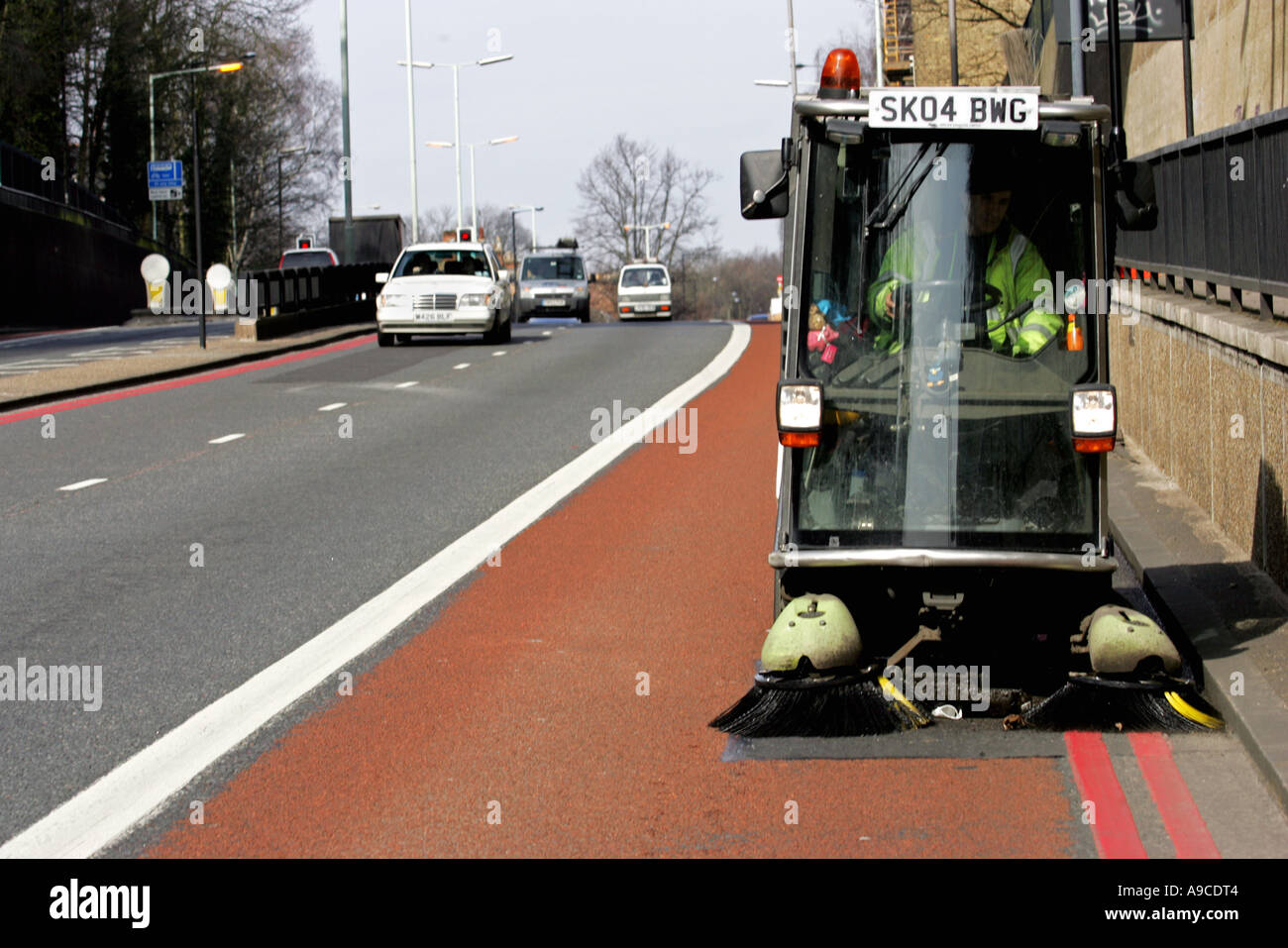 A road sweeper on Highgate Hill North London Stock Photo Alamy