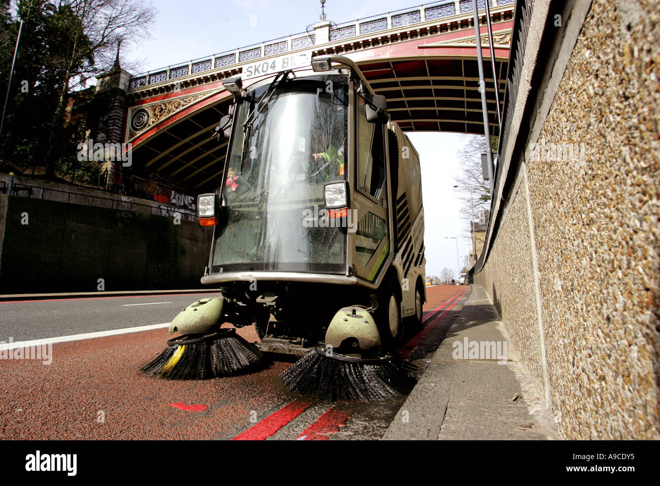 A road sweeper on Highgate Hill North London Stock Photo Alamy