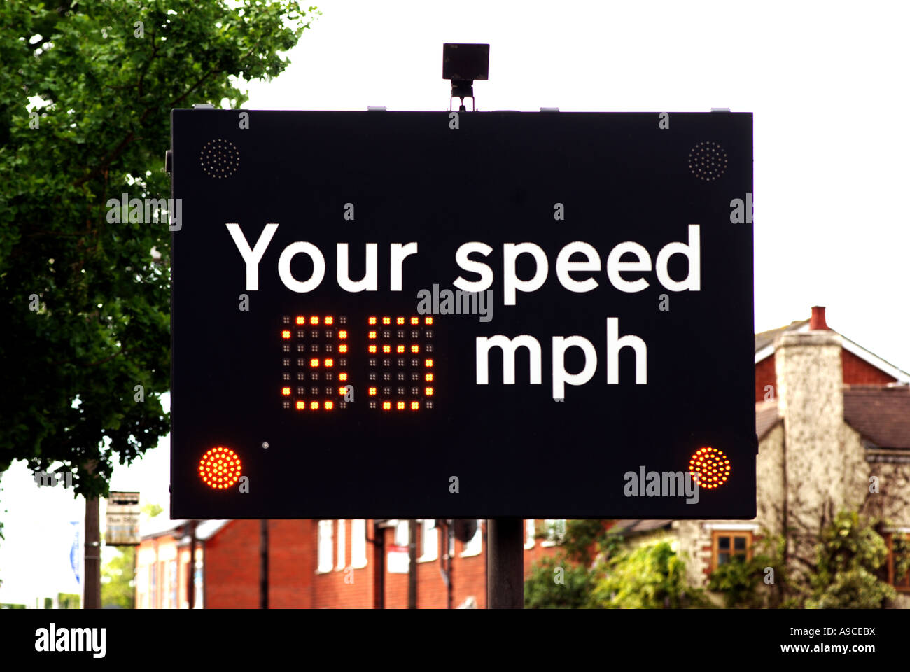 Automatic vehicle speed indicator in 30 mph limit, Barford, Warwickshire, England, UK Stock Photo