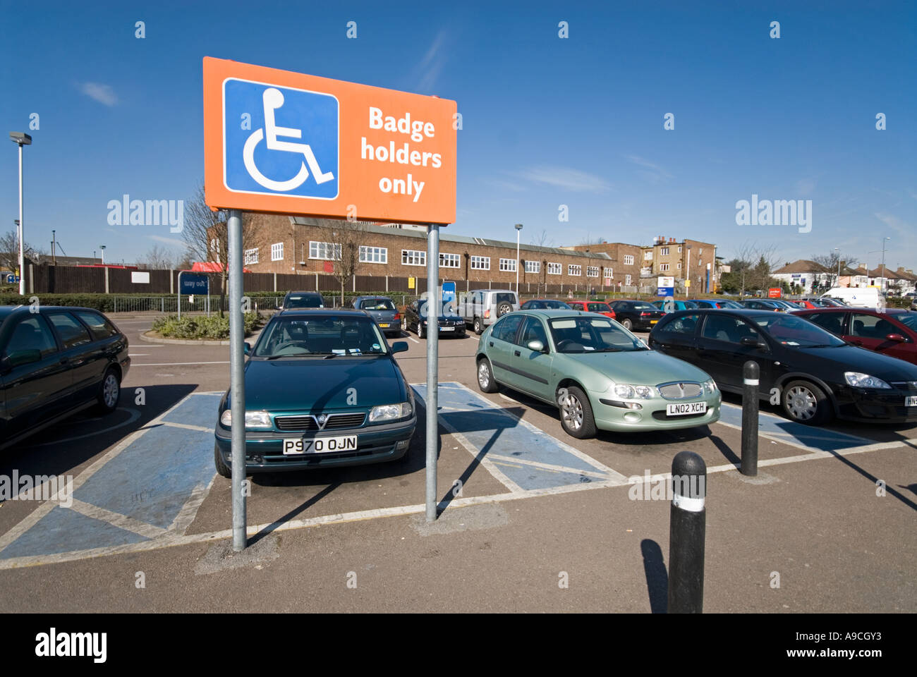 Sign indicating parking bays reserved for disabled drivers Stock Photo