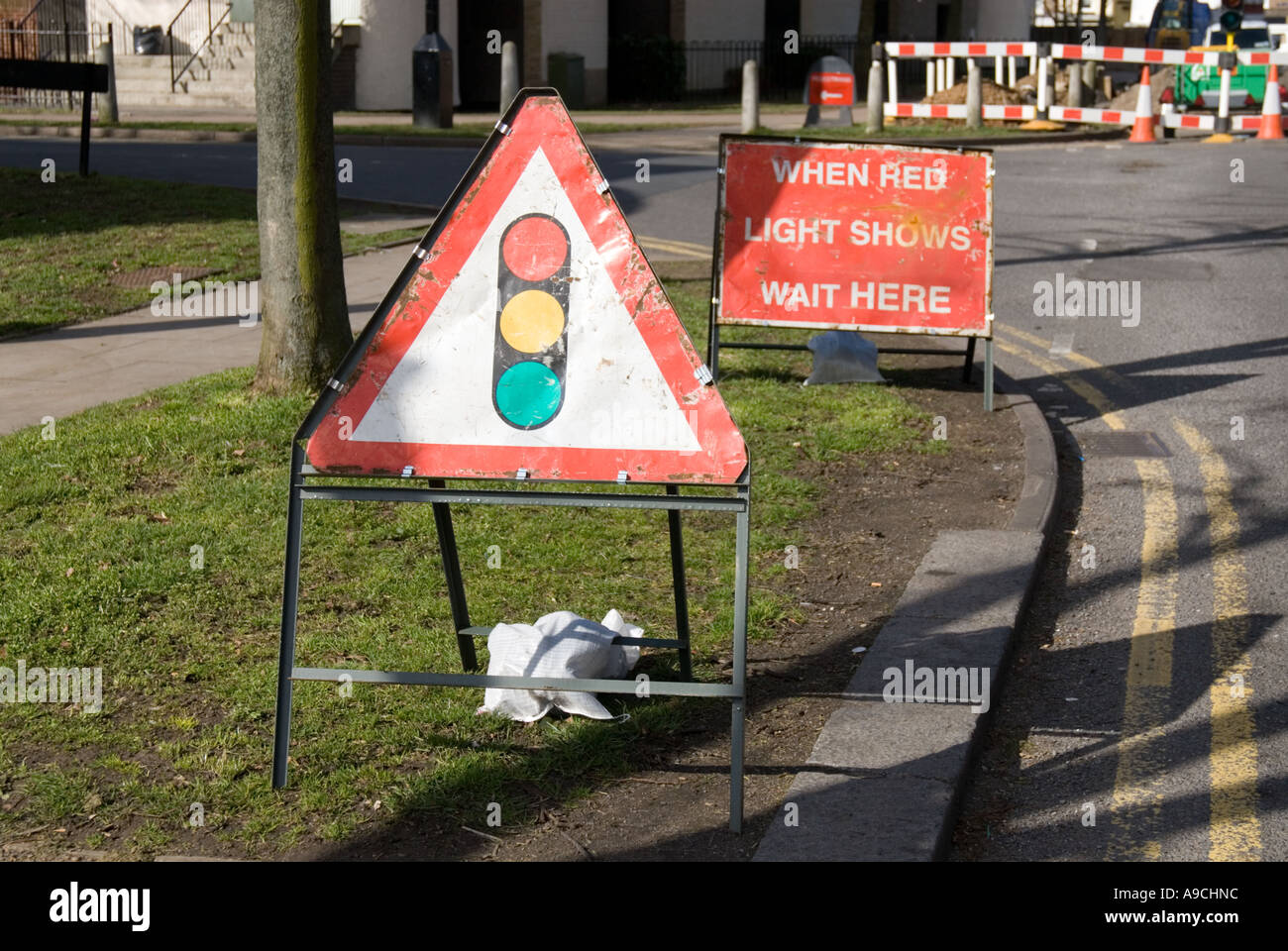 Stop here when red light showing road sign Stock Photo - Alamy